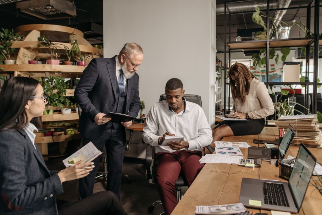 Employees collaborating in a high-growth organization with a strong team culture focused on communication, trust, and leadership development